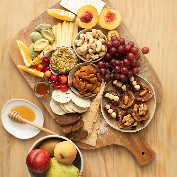 Roasted almonds flavoured with cheese and chilli placed on a cheese platter