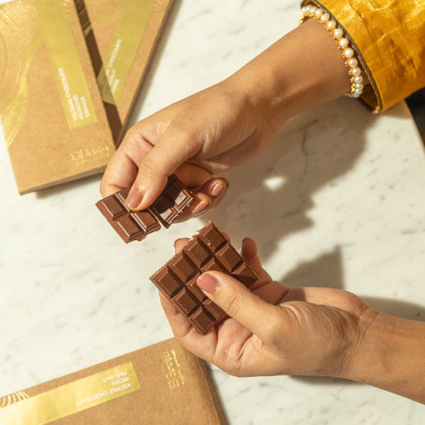 Smooth, thin chocolate bars in bold flavors: Pecan & Pink Salt, Coffee & Hazelnut, Honeycomb & Peppercorn, Pistachio & Orange Zest.