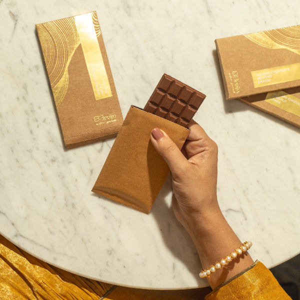 Smooth, thin chocolate bars in bold flavors: Pecan & Pink Salt, Coffee & Hazelnut, Honeycomb & Peppercorn, Pistachio & Orange Zest.