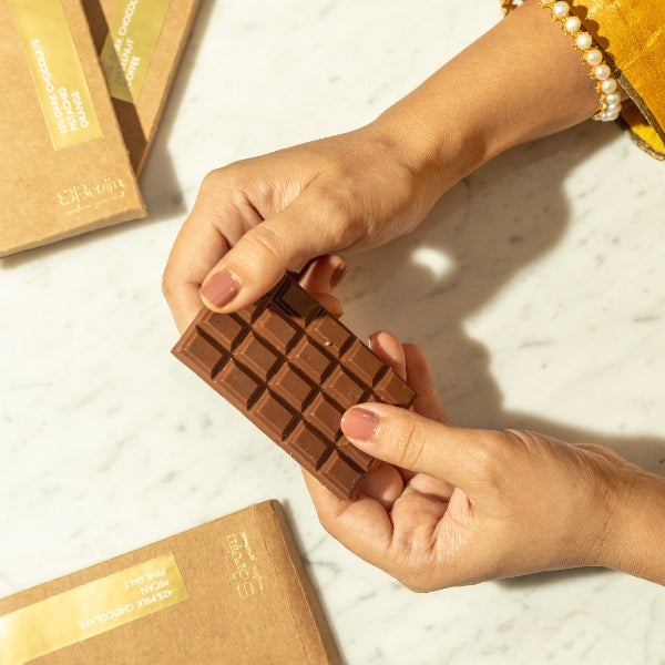 Smooth, thin chocolate bars in bold flavors: Pecan & Pink Salt, Coffee & Hazelnut, Honeycomb & Peppercorn, Pistachio & Orange Zest.