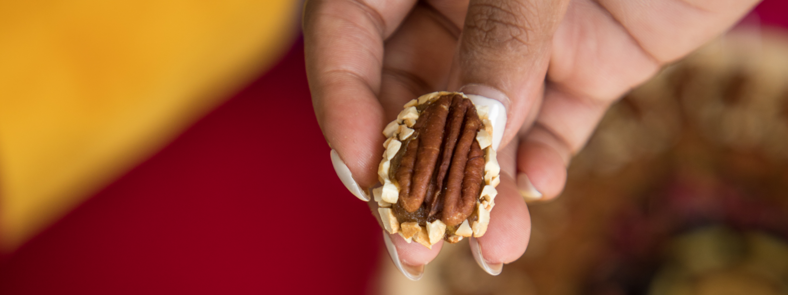 A pecan stuffed with a paste made from molten dates and spice