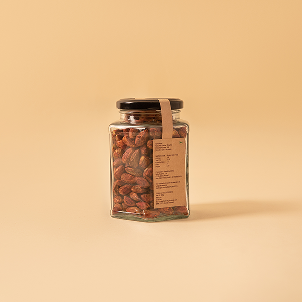Roasted pistachio kernels flavoured with chilli and lime accompanying a light summer drink