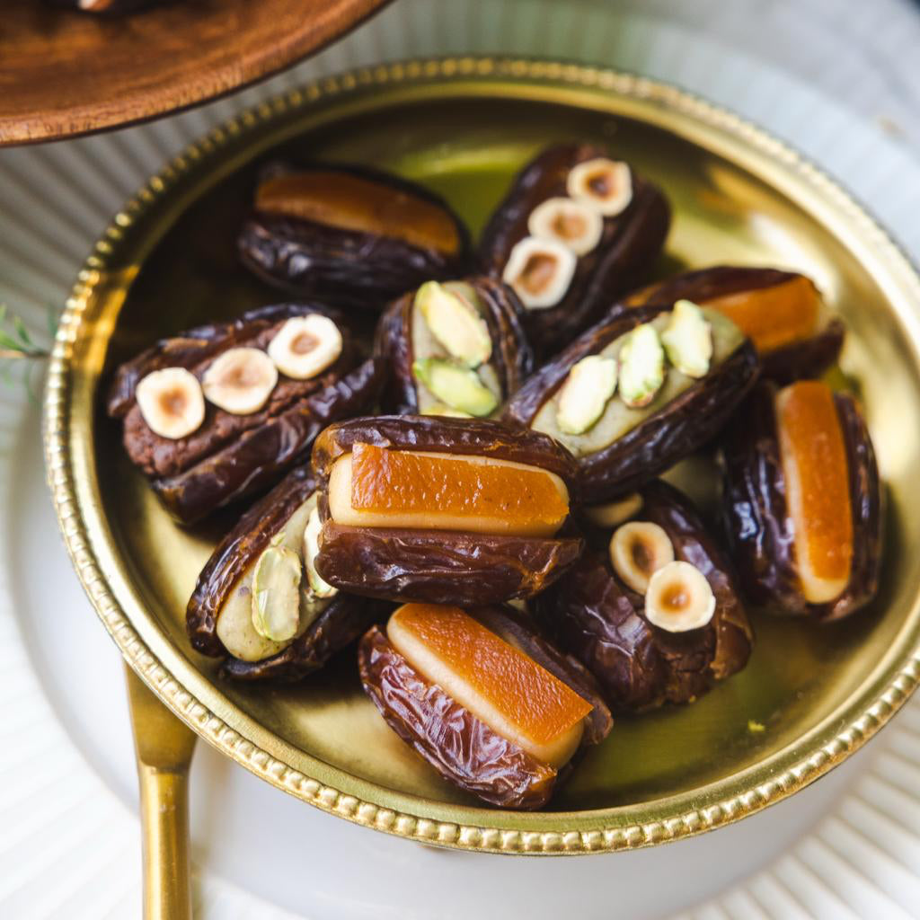 Medjool dates stuffed with artisanal marzipan flavours of pistachio, bitter almond, orange and chocolate.