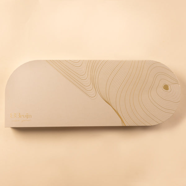 Signature Tray closed box with minimal golden line design on cream background.