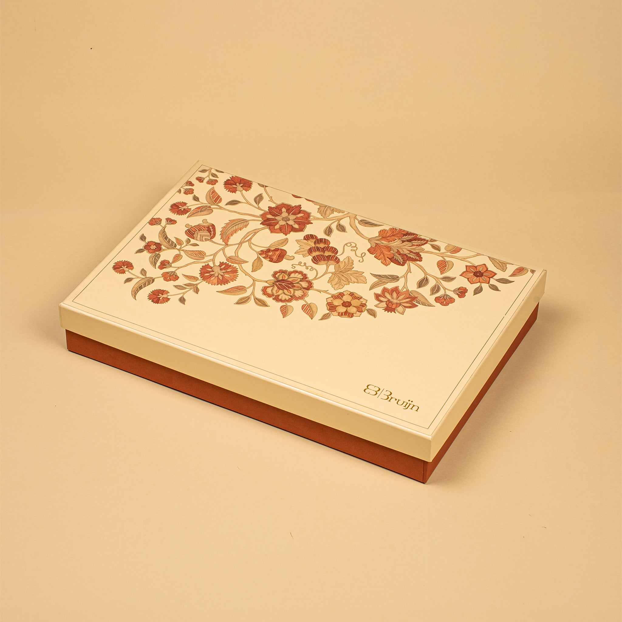 A rectangular cream-colored box with a floral pattern on the lid and a brown base, photographed on a matching cream background. The brand name 'Elvin' is printed in gold near the bottom right corner of the lid.
