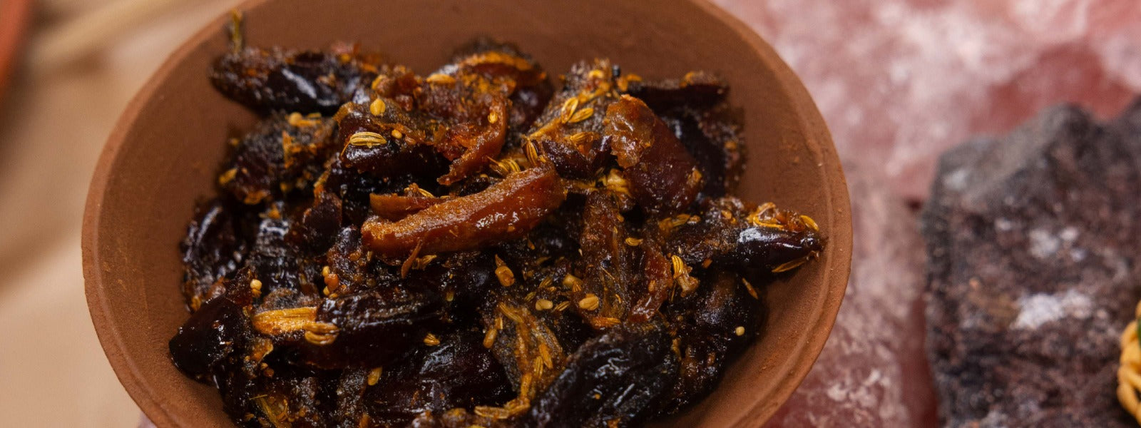 A jar of chopped dates tempered with spices in mustard sauce for a sweet and savoury experience