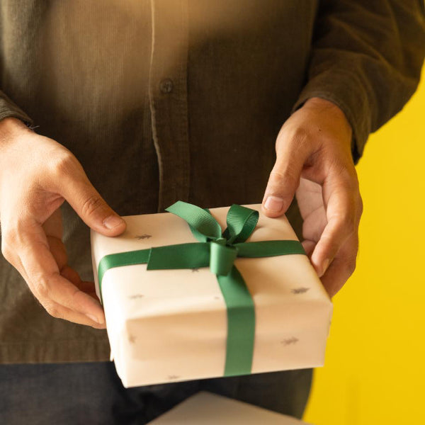 An edible pinecone made from molten dates, candied dried fruits and biscuit