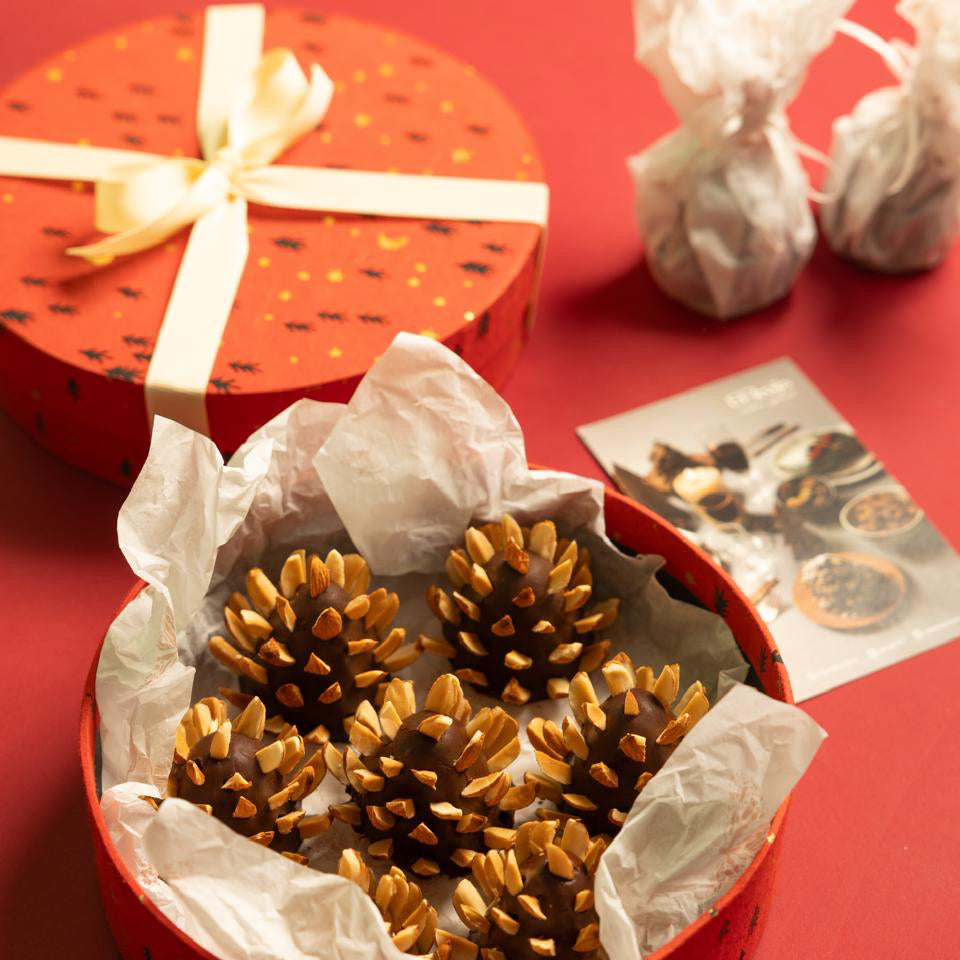 An edible pinecone made from molten dates, candied dried fruits and biscuit