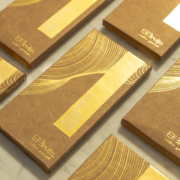 Smooth, thin chocolate bars in bold flavors: Pecan & Pink Salt, Coffee & Hazelnut, Honeycomb & Peppercorn, Pistachio & Orange Zest.