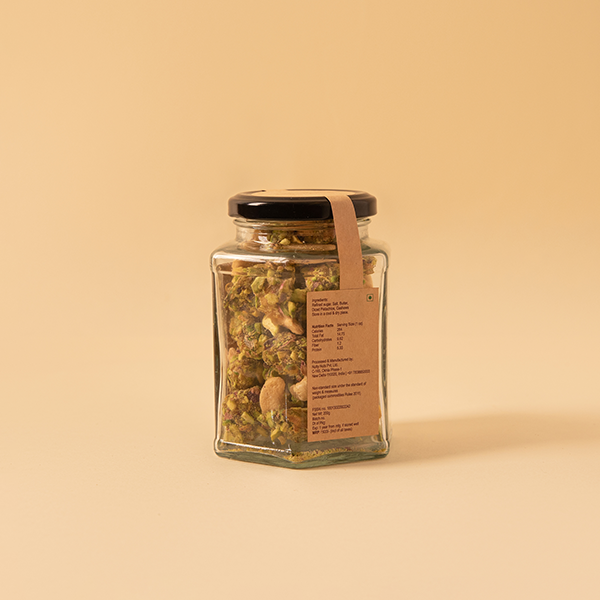 Salted roasted cashews dipped in caramel pistachio bits for Indian weddings and festivities