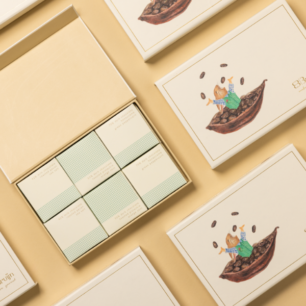 Packaged snacks with illustrated designs on a beige background