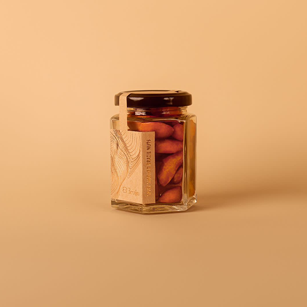 Jar of spicy smoked Brazil nuts – 90g, dry roasted, keto-friendly snack.