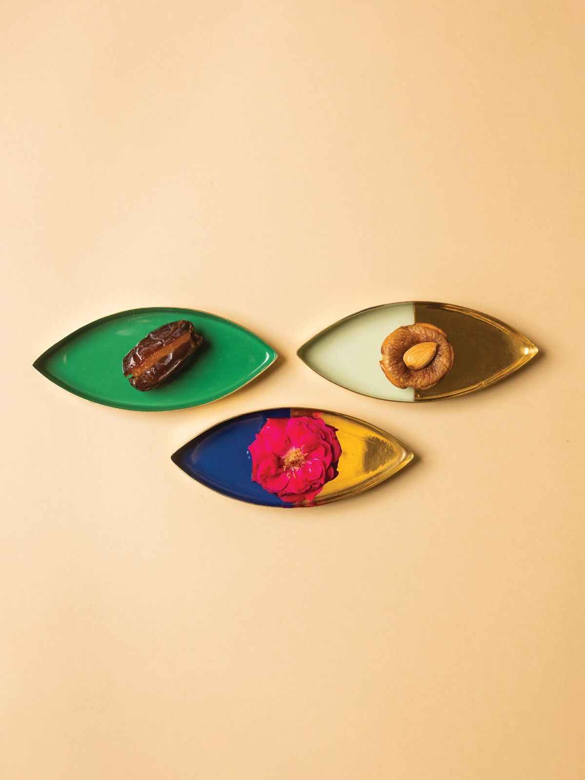 Individual dried fruits like dates and figs laid out on platters, ideal for hosting and food presentation