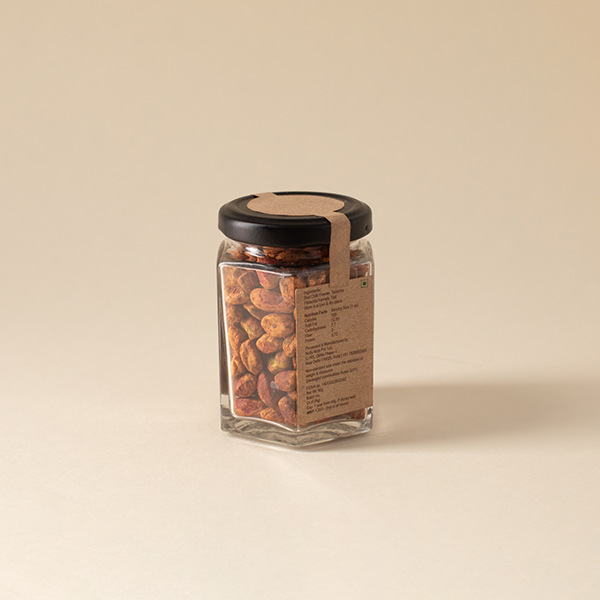 Roasted pistachio kernels flavoured with chilli and lime accompanying a light summer drink