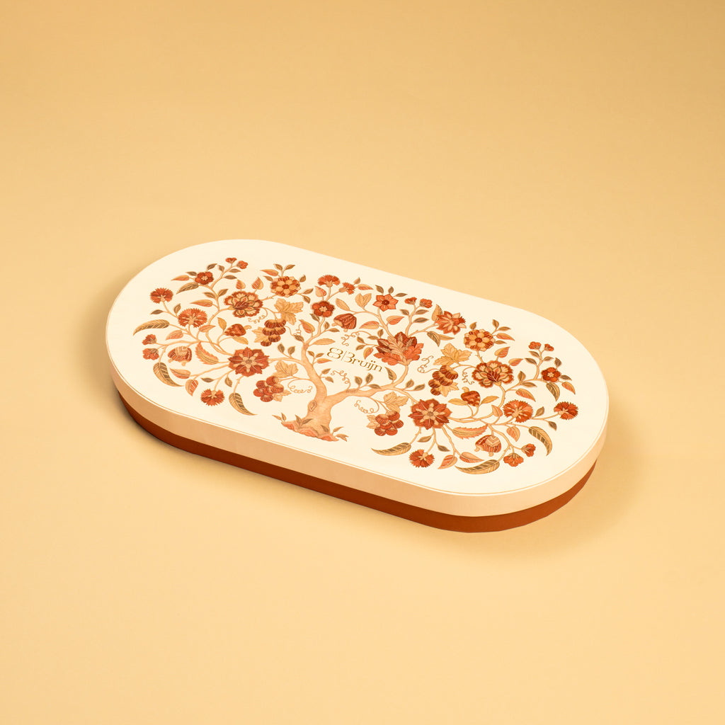 A handprinted illustration drawn by Jaamuni Samundar that holds 24 dried fruits  like dates, walnuts, pecans and figs stuffed with nuts