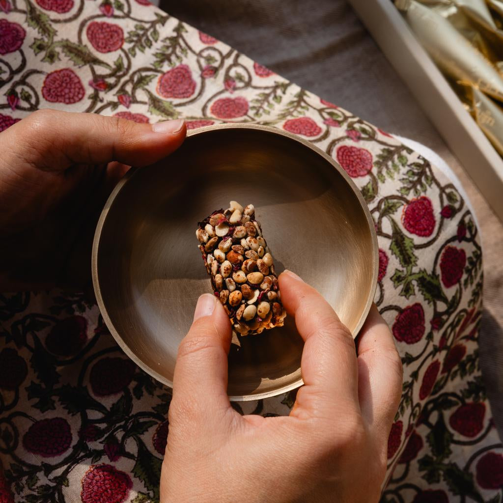 Truffles made with molten dates, peanut butter, rose, chironji and chocolate