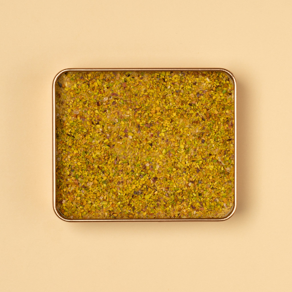 Tin with Pistachio Knafeh. A delicious paste of pistachios, cacao butter, ghee, gluten-free vermicelli, milk powder, jaggery, dates & salt.