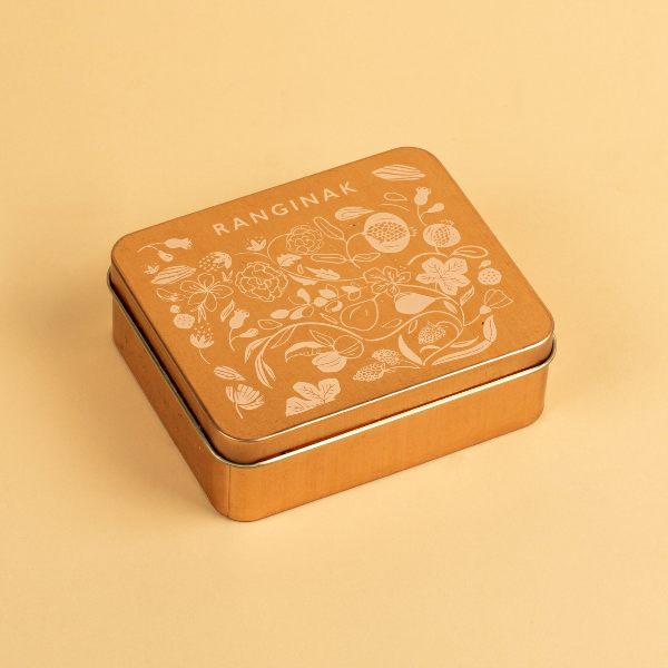 Decorative tin box with floral patterns and 'RANGINAK' branding.