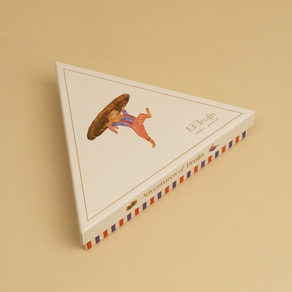 Triangular box with Aiman rabbit character on a beige background