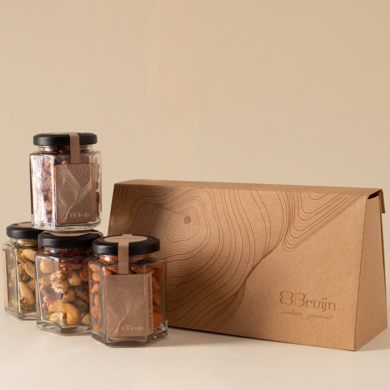 Jars of dried fruits and a branded brown box 
