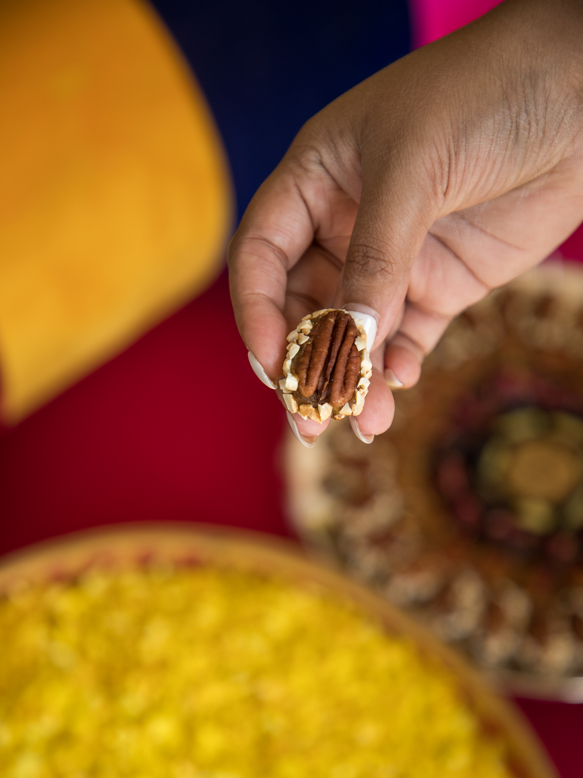 A pecan stuffed with a paste made from molten dates and spice 