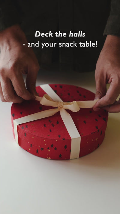 An edible pinecone made from molten dates, candied dried fruits and biscuit