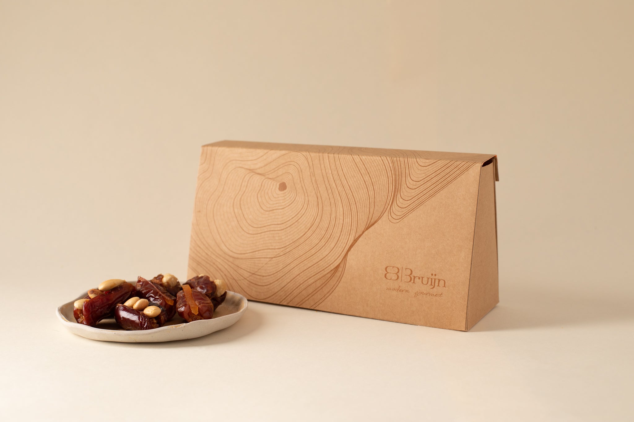 assorted Emirati Khidri collection dates with roasted almonds, toasted hazelnuts, candied orange peel and plain ones.