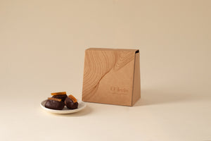 Khidri dates dipped in dark chocolate & topped with candied orange