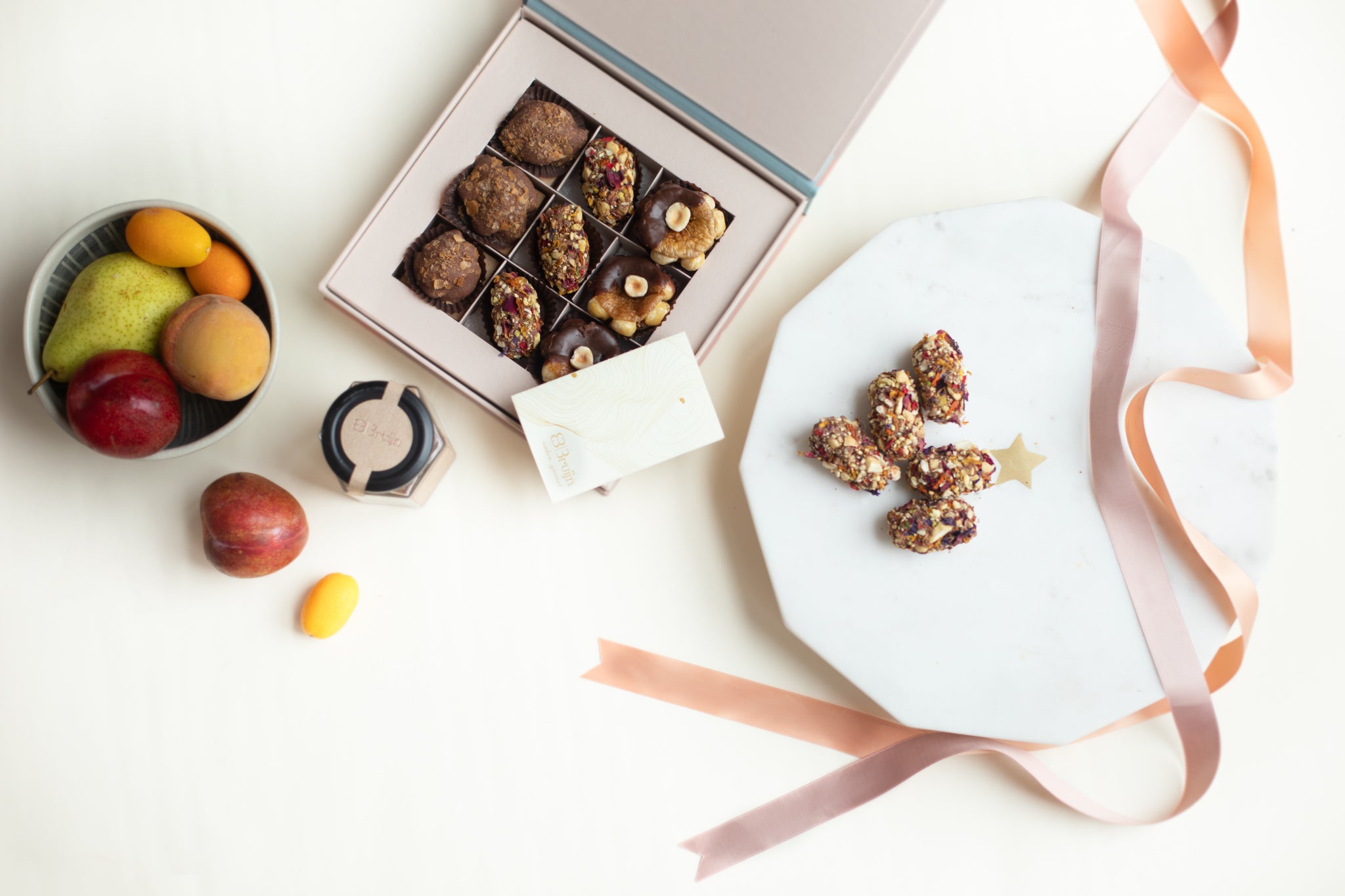 Intimate box with almond rocks, date tamariyas (date fudge) and hazelnut & cinnamon figs dipped in dark chocolate for small celebrations 