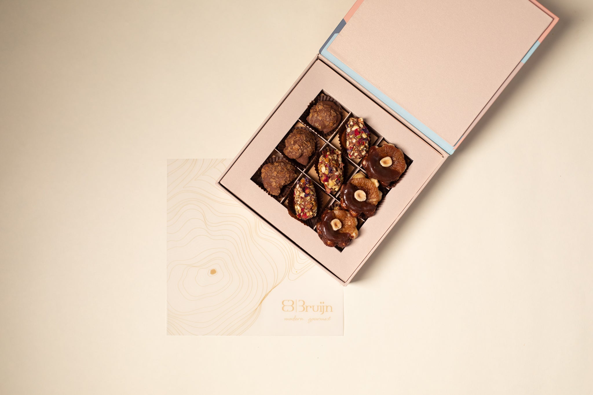 Intimate box with almond rocks, date tamariyas (date fudge) and hazelnut & cinnamon figs dipped in dark chocolate for small celebrations 